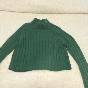 Green turtleneck sweater